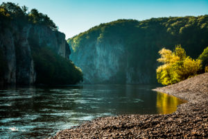The Danube Gorge Weltenburger Enge at Weltenburg Monastery shortly after sunrise, Kelheim district, Bavaria, Germany The Danube Gorge Weltenburger Enge at Weltenburg Monastery shortly after sunrise, Kelheim district, Bavaria, Germany
